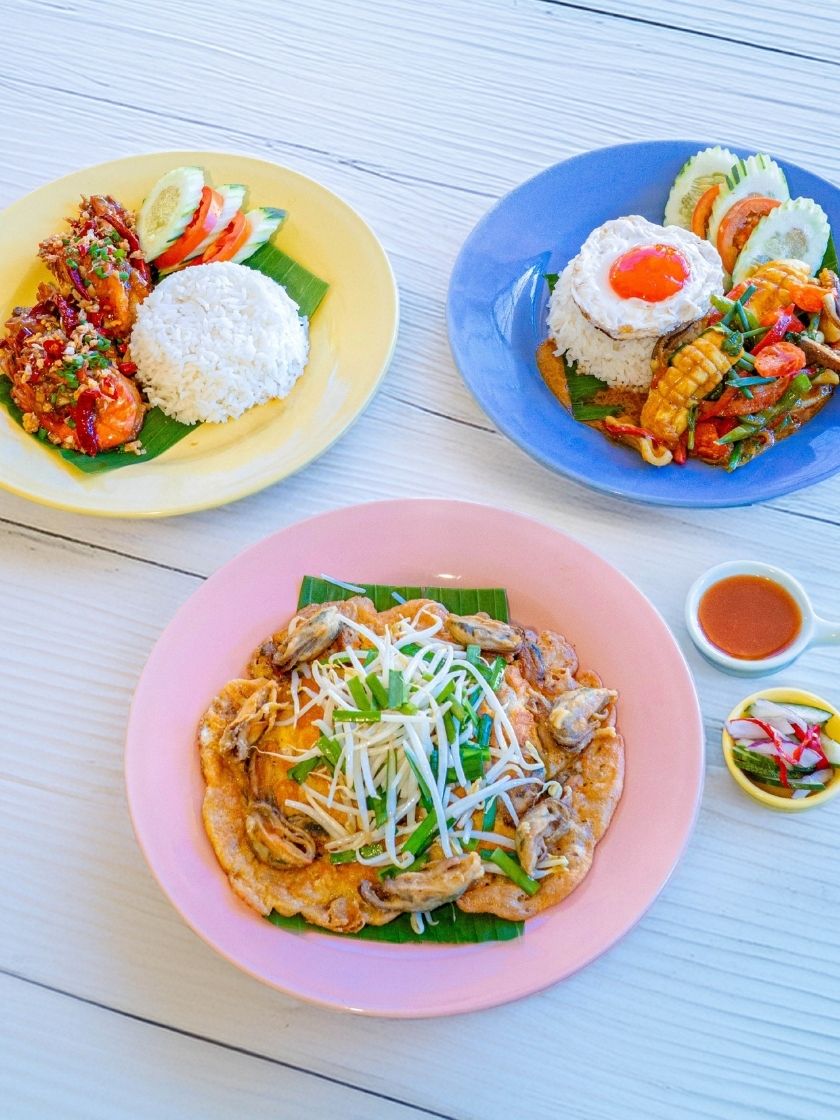 Savor Andaman-fresh seafood with bold local flavors—Pla Muek salted egg squid, crispy Hoy Thod and Goong Thod Kua Prik Glure, Phuket-style favorites.